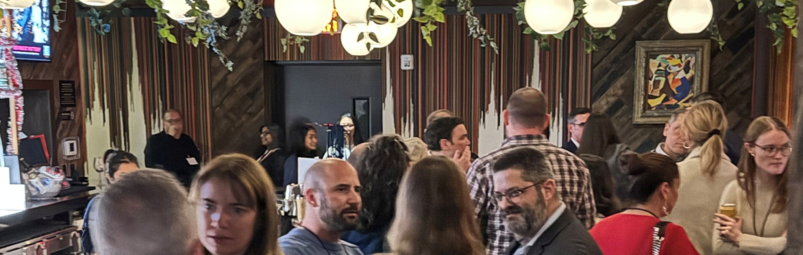 People enjoying themselves at a party while discussing the waterfront