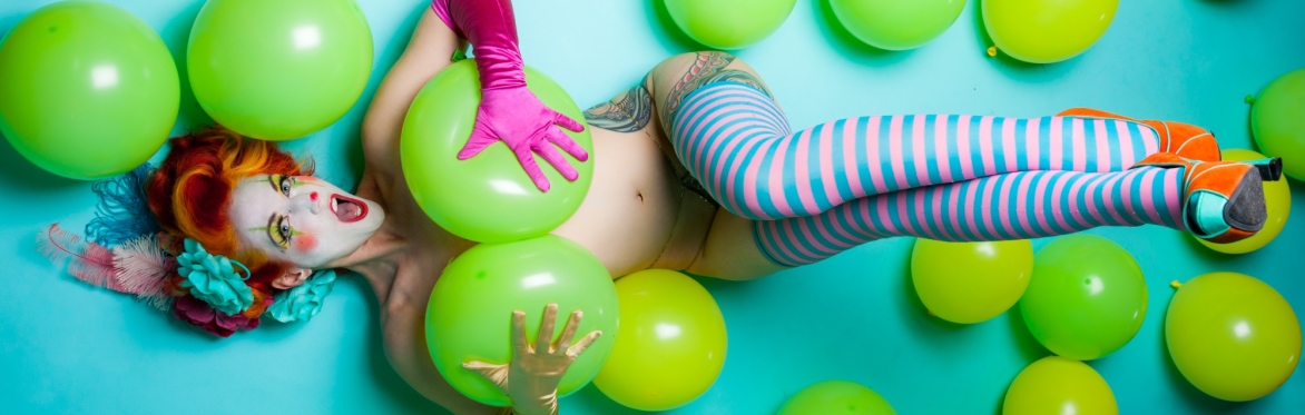 Melody Mangler as a saucy clown with balloons