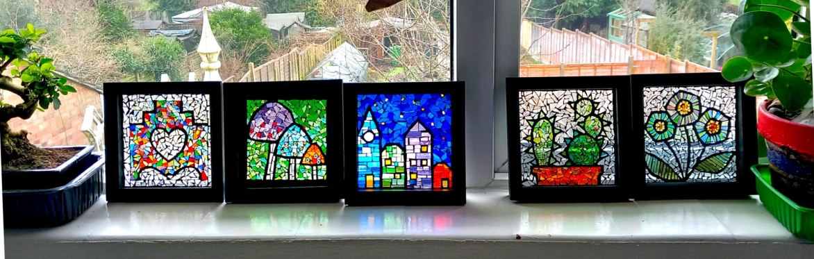 Five completed framed glass-on-glass mosaics
