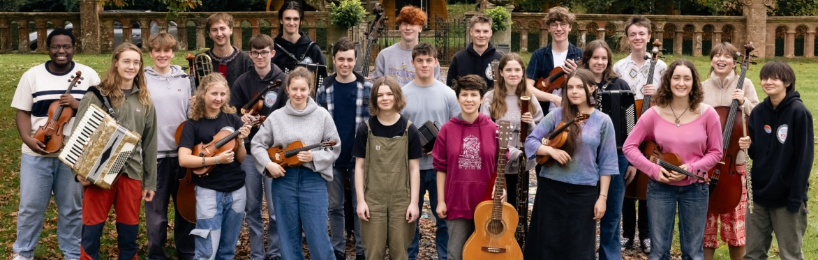 A group of young musicians, smiling.