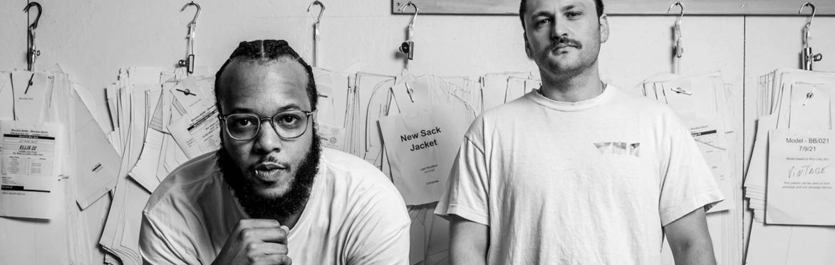 Corey Fonville and Sam Fribush in a tailoring studio
