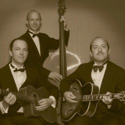 Old style photo of three musicians, the Spats Langham Trio, showing two guitarists and a double bass player