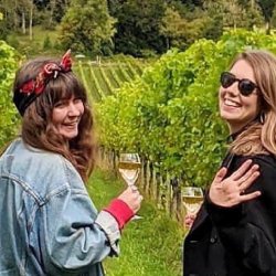 two girls drinking wine at albury vineyard
