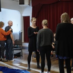 A montage of photos of ritual participants standing, moving and connecting.