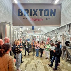 Brixton Brewery tour group in brewing arch.