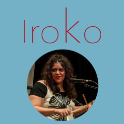 The word Iroko with an image of Laura smiling and playing the drum