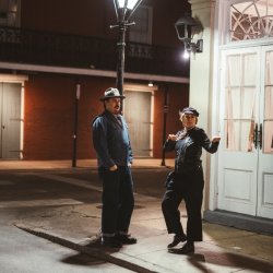 A.W. Cardinal and Jasmine Colette of Blue Moon Marquee standing on a street corner in New Orleans. Blue Moon Marquee will be appearing live at The Crypt in Olympia on December 4, 2026
