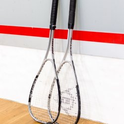 Student learn to play squash
