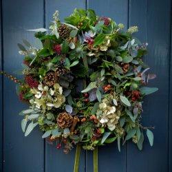 A Christmas wreath hanging on a door