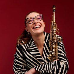 Jess Gillam with saxophone