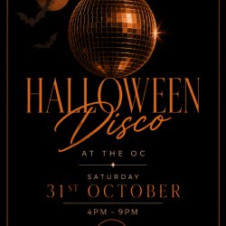 A dark background, disco ball, details of event