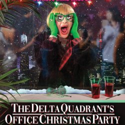 Delta, blonde bob with outrageous green rimmed glasses and green gloves, is clasping her face in sheer horror that a party may happen without her... and that someone has vomited in the fax machine