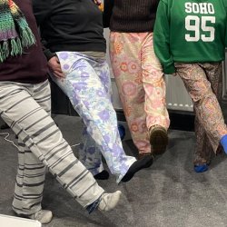4 people legs wearing pyjama bottoms