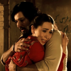 A man and woman hug desperately
