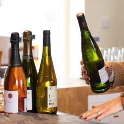 Bottles and glasses of wine on a wooden barrel