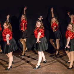 Women smiling and dancing.