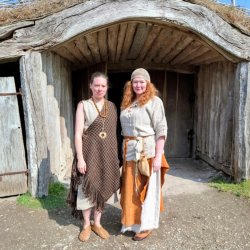 Two of our heritage textile tutors in prehistoric outfits