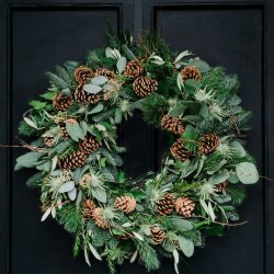 Christmas Wreath with fir cones and lush green foliage.