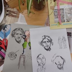 A cardboard gallery space featuring illustrated figures from Nottingham Mencap members’ artwork walking around and viewing artwork also created by Nottingham Mencap. Text floats in front.
