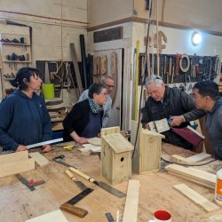 Open Bench Beginners session - group making birdboxes