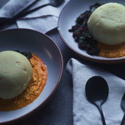 Two bowls of iyan with egusi and efo riro