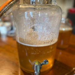 A kilner jar of kombucha with a tap