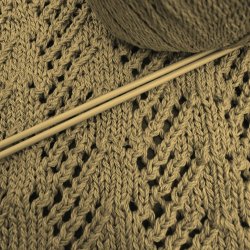 Example of Victorian lace knitting, with ball of yarn and thin knitting needles (in sepia)