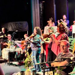 musicians playing fiddles and whistle