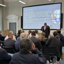 An image with a man presenting at the first YoRIC event