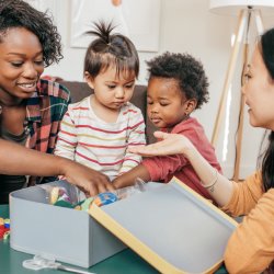 Photo of parents playing with toddlers