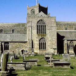 Cartmel Priory against a blue sky