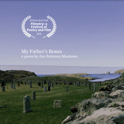 a graveyard with green hills and sea in the background