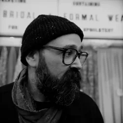 A black and white photo of Andrew Farmer, AKA FRMR