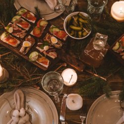 Long table set up for dinner in a rustic setting