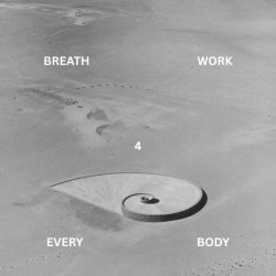 Black and white photograph of a spiral in sand