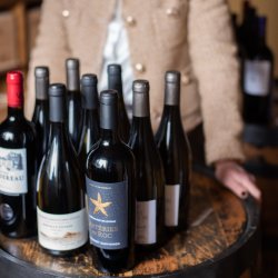 wine bottles on a barrel