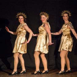 Women smiling and dancing.