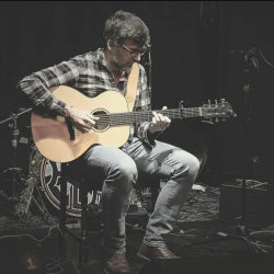 Nico G playing guitar
