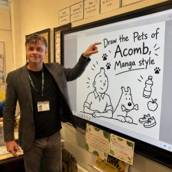 Person standing beside a large interactive display showing a digital drawing activity titled “Draw the Pets of Acomb, Manga style”. The screen features cartoon illustrations and drawing tools.