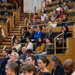 People sat watching a keynote