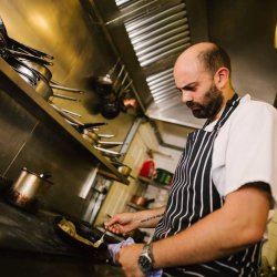 Photo of chef Lee Rushforth cooking at a hob