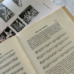 books with illustrations of harps and sheet music