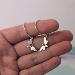 photo shows a pair of silver heart earrings
