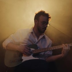 Man playing guitar on stage