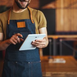 Restaurant worker using tablet