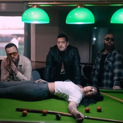 Made You Look / Made You Stare posing on a pool table