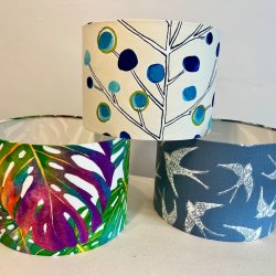 This image is a stack of three 30cm drum lampshades in coloured fabric