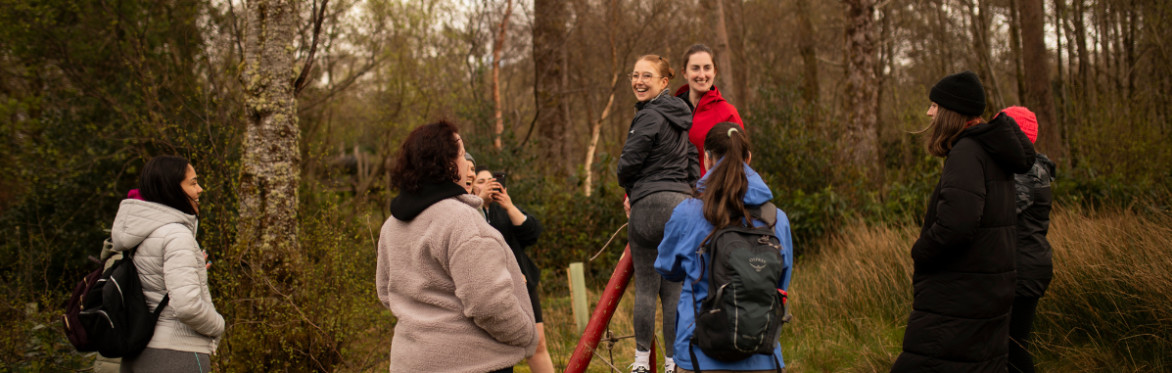 Adult summer camp guests spending time together outdoors