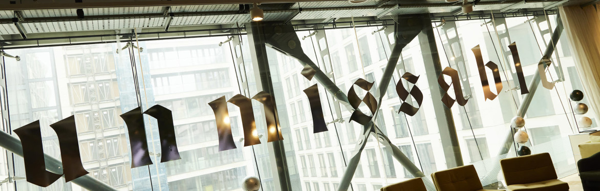 An event space window with large shiny silver lettering reading UNMISSABLE.