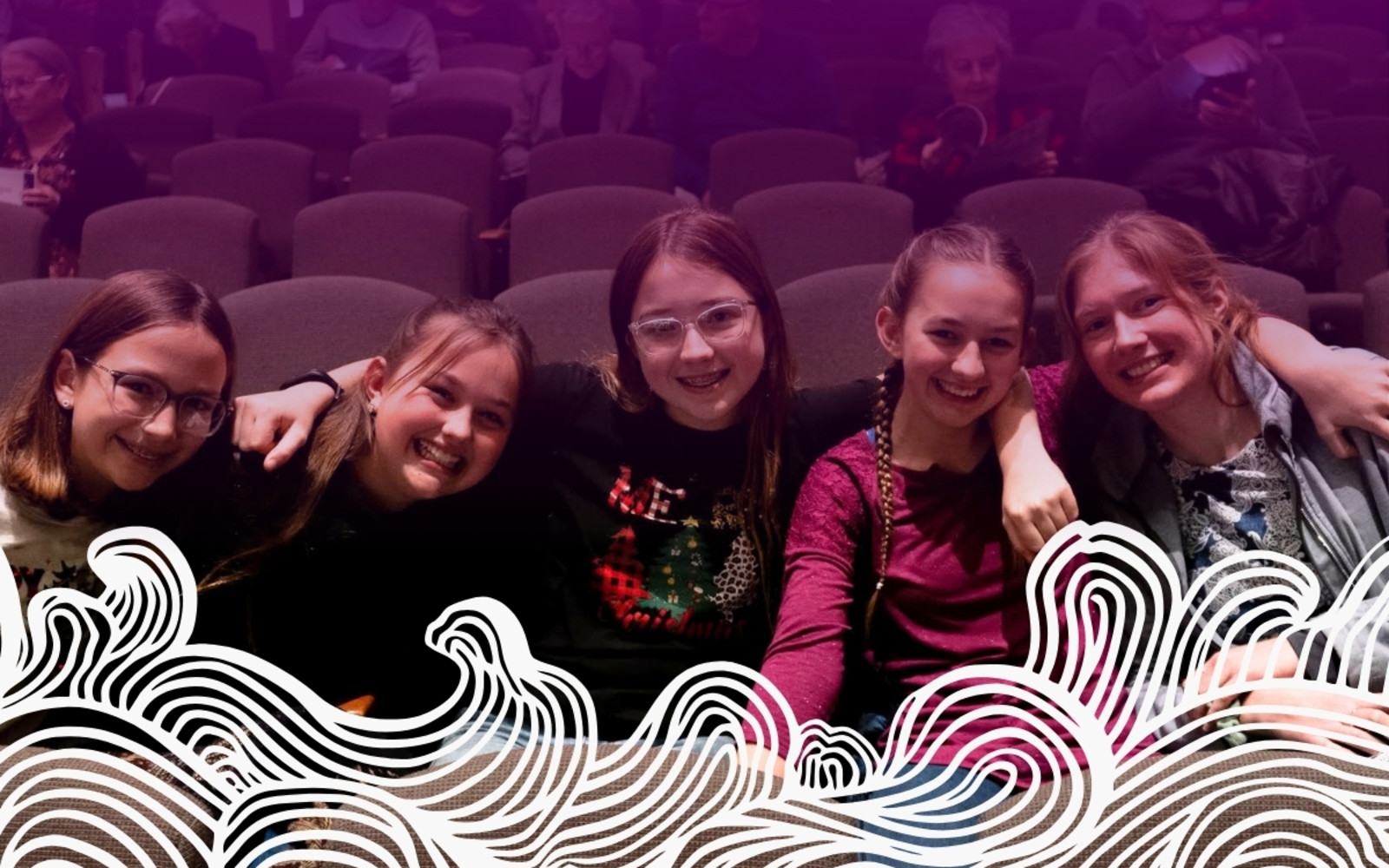 girls smiling in the Ottawa auditorium